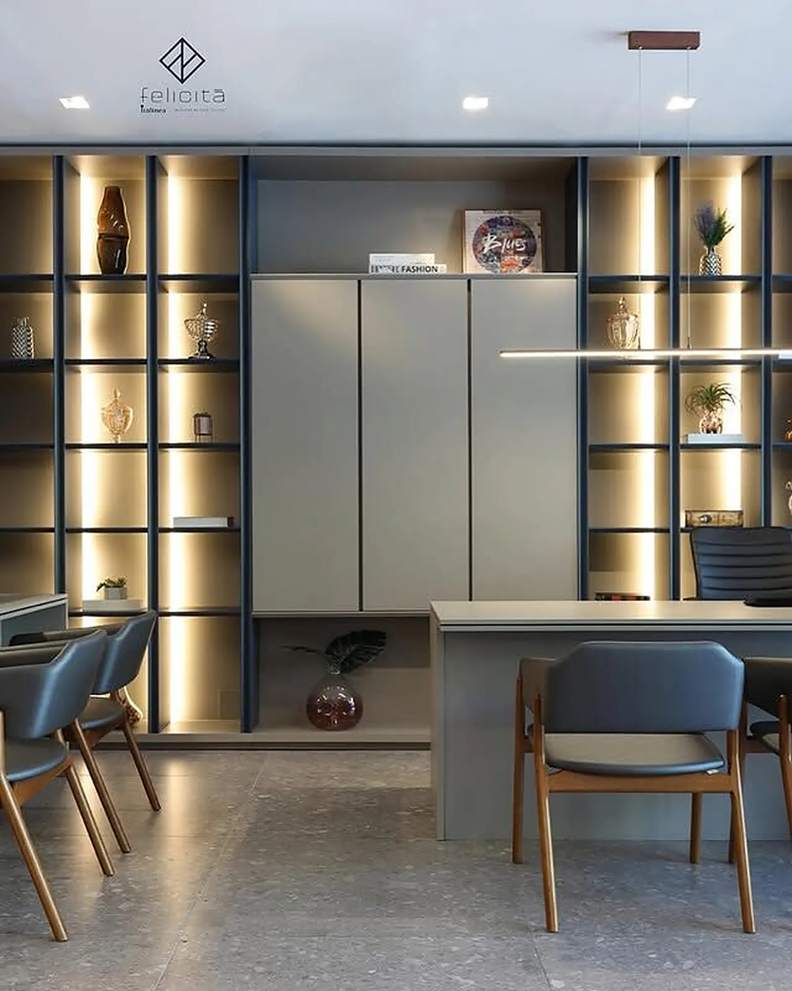 Sala de reunião do showroom Italínea Felicità com estante iluminada e cadeiras estofadas